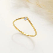 14k Gold filled chevron ring with a small diamond on a light background